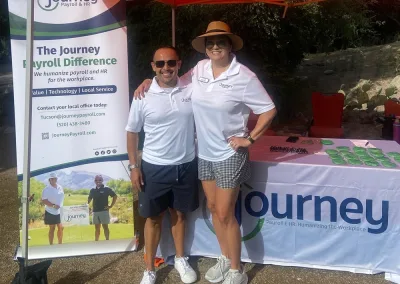 two people at a golf event