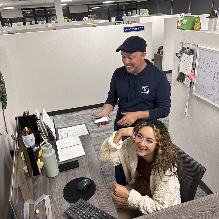 two people working together in an office