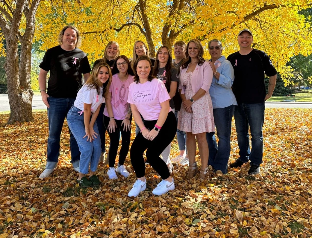 group of people outside in fall foliage